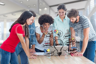 Digital composite image of college students using laptop with various icons in college