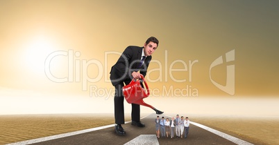 Digital composite image of manager watering employees on street