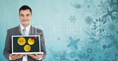 Portrait of businessman holding laptop against floral patterned background