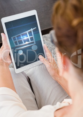 Woman using Tablet with Shopping trolley icon