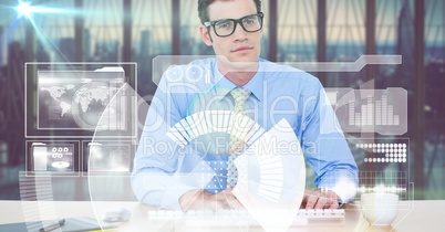 Digitally generated image of businessman typing while using futuristic screen in office