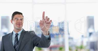 Smiling businessman touching transparent screen