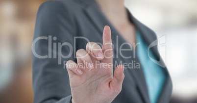 Midsection of businesswoman touching screen