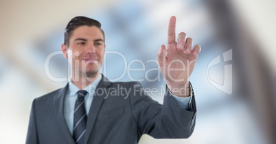 Smiling businessman touching screen