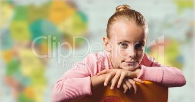 Girl on chair against blurry map