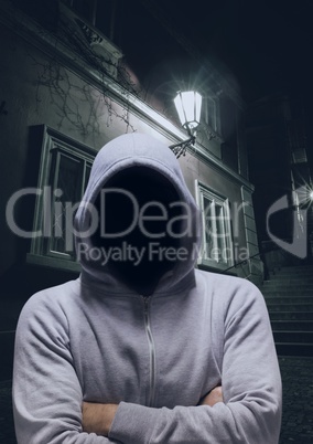 Anonymous Criminal in hood on dark street