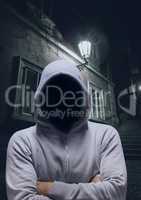 Anonymous Criminal in hood on dark street