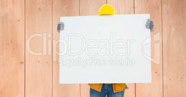 Construction worker holding blank bill board