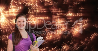 Digitally generated image of woman with books looking at glowing mathematical equations
