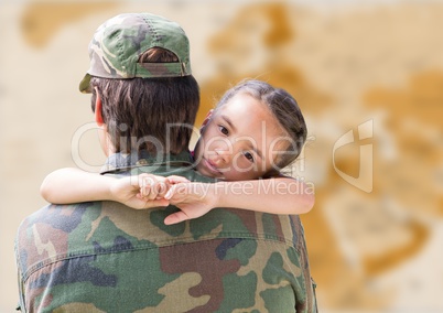 Soldier and daughter against blurry brown map
