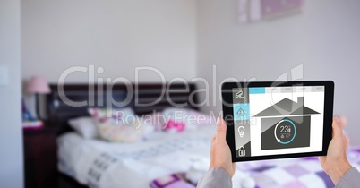 hands using application of smart home on digital tablet