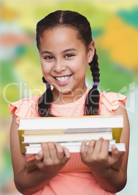 Girl with books against blurry map