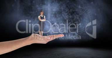 Digital composite image of woman standing on palm against interface graphics in background