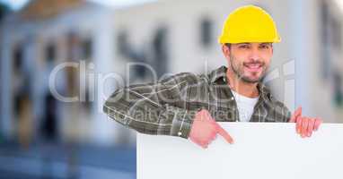 Architect pointing at blank bill board