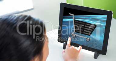 Cropped image of person touching shopping cart icon on tablet PC