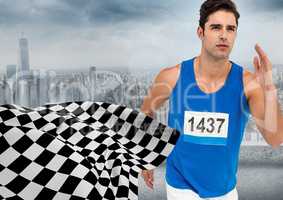 Male runner sprinting against skyline and checkered flag