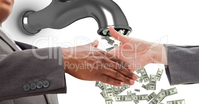 Close-up of business people shaking hands with money flowing from tap