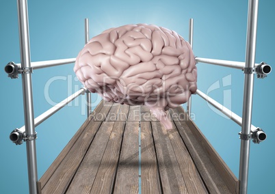 Brain with flare on scaffolding against blue background