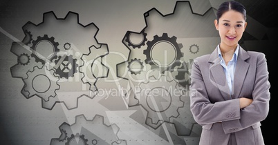 Digital composite image of businesswoman with gears in background