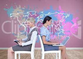 Businesswomen collaborating working in front of Colorful Map with paint splattered wall background