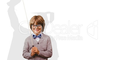 Digitally generated image of smiling boy holding stick with shadow of graduate student in background