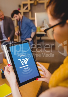 Woman using Tablet with Shopping trolley icon