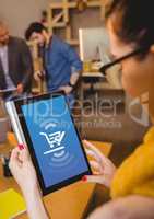 Woman using Tablet with Shopping trolley icon