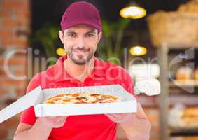 Deliveryman showing the pizza in the restaurant