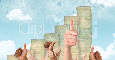 Hands gesturing thumbs up against coin graph