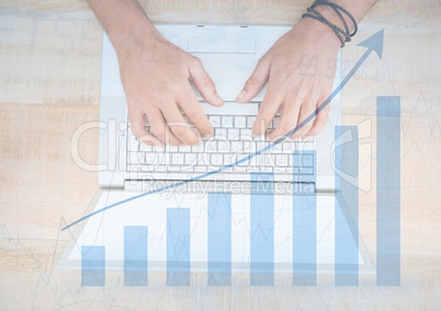 Overhead of hands on laptop with blue graph overlay