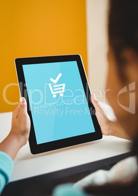 Woman using Tablet with Shopping trolley icon