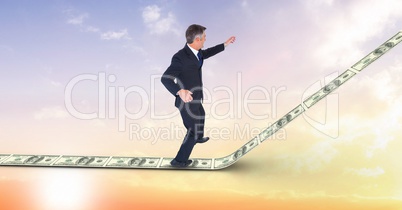 Digital composite image of businessman standing on money walkway