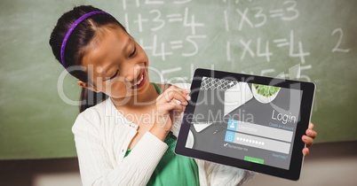 Schoolgirl looking at log in page on tablet PC