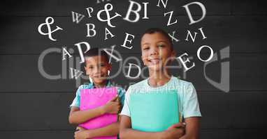 Smiling schoolboys holding books while letters flying in background