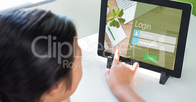Person touching log in page on digital tablet's screen
