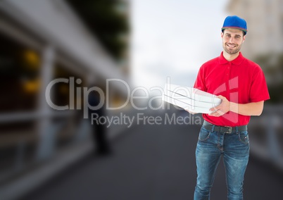 Happy deliveryman with pizza boxes in a bridge