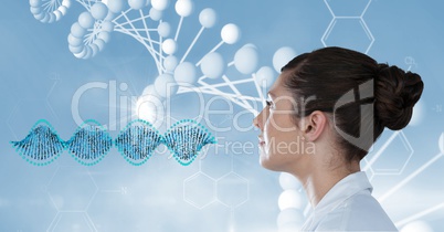 Female doctor looking at DNA structure