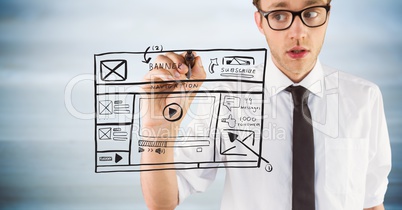 Business man with marker and website mock up against blurry grey wood panel