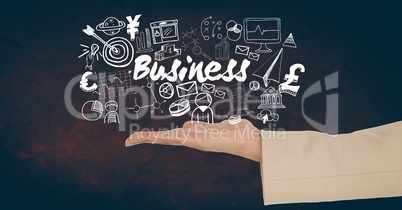 Cropped image of hand holding holding business text amidst various icons