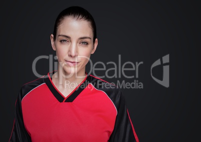 Woman with jersey against dark grey background