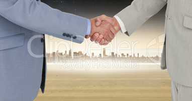 Digital composite image of businessmen shaking hands