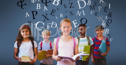 Multi ethnic children holding books with letters flying in background