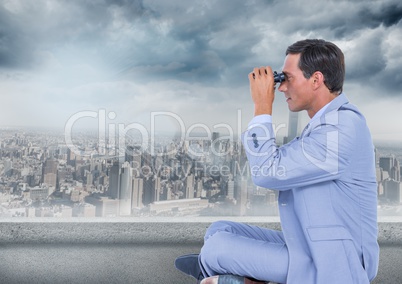Business man with bionoculars against grey skyline and clouds