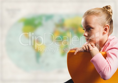 Girl on chair against blurry map