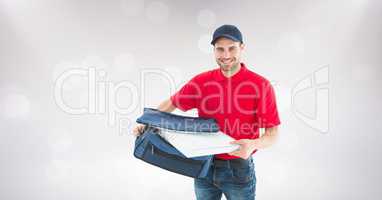 Delivery man removing pizza box from bag