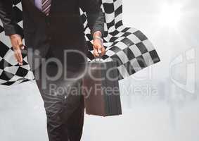 Business man lower body with briefcase against white skyline and checkered flag