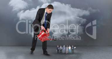 Manager watering employees against sky