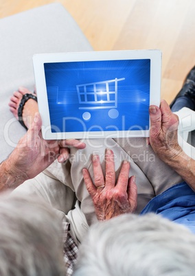 Old People using Tablet with Shopping trolley icon