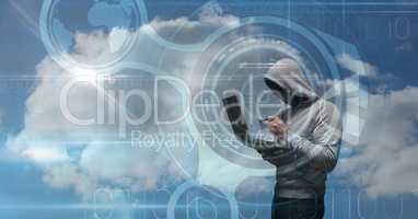 Digital composite image of hacker using credit card and laptop on virtual screen