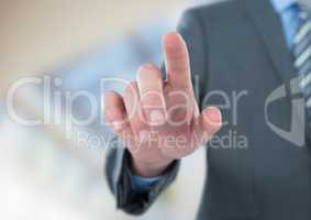Midsection of businessman touching screen
